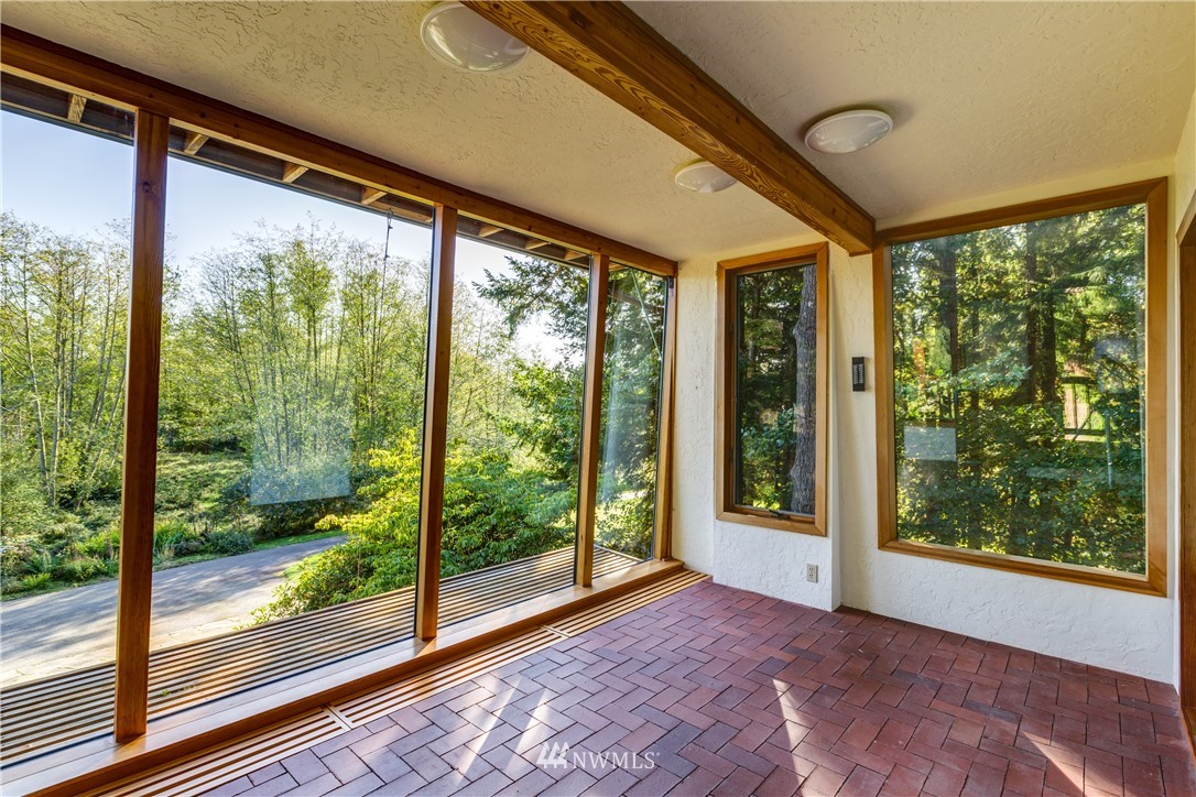 5852 Storr Road Ferndale, WA 98248 - Photo 5 of 25 a view of a big room with an outdoor view and floor to ceiling window