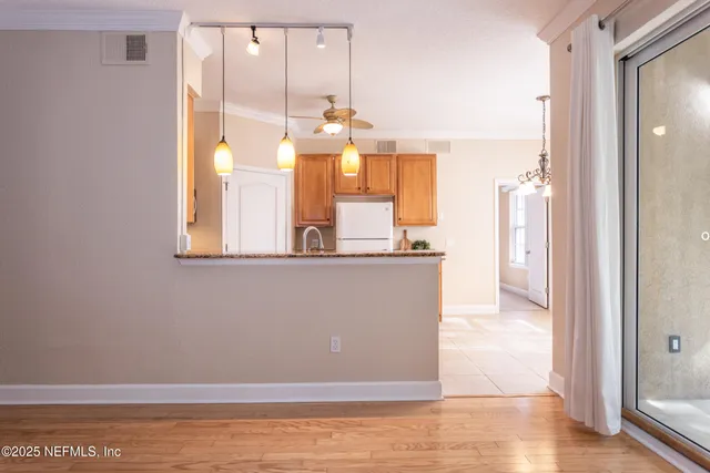 a view of a living room with a large window