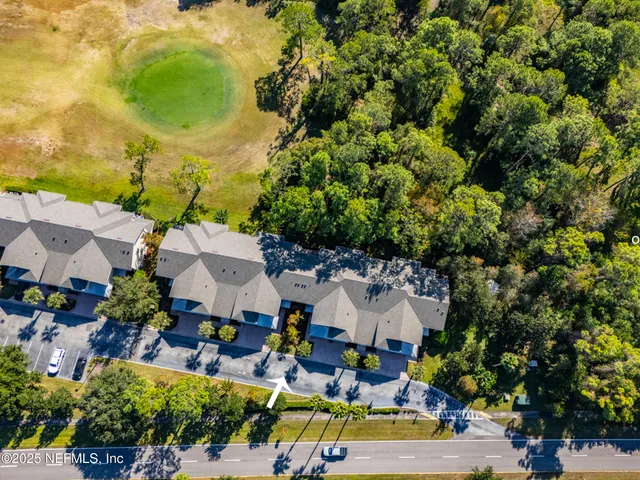 an empty room with a ceiling fan and window