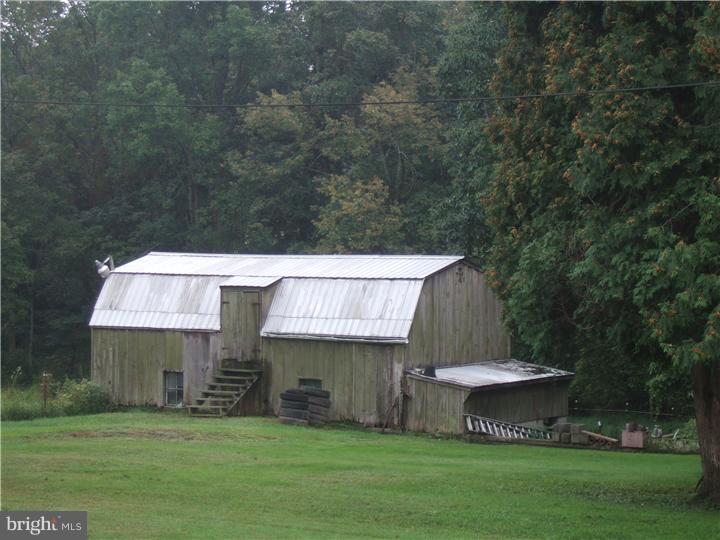 4052 Lehnenberg Road Riegelsville, PA 18077 - Photo 3 of 19 a view of a house with a yard and a fountain