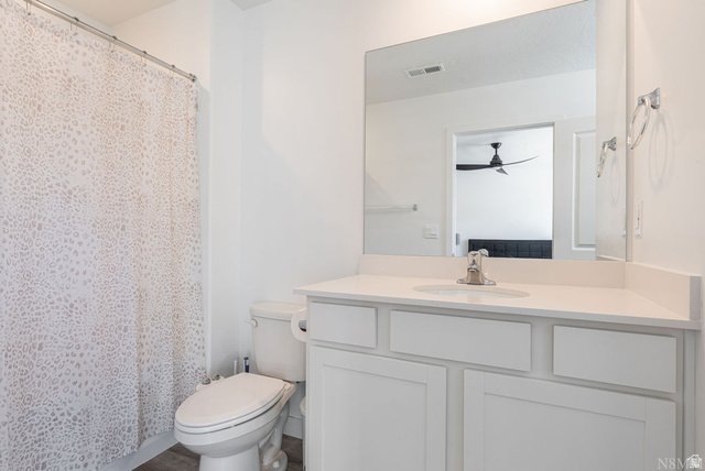 1693 Devils Gdn Lane Washington, UT 84780 - Photo 28 of 64 Bathroom featuring a white vanity with an integrated sink, polished chrome faucet, and a large wall-mounted mirror