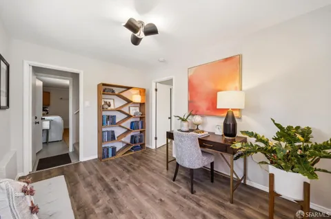 a bedroom with a bed and a tv