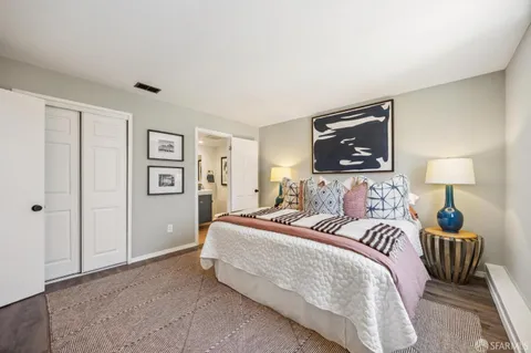 a view of a kitchen with sink cabinets and wooden floor