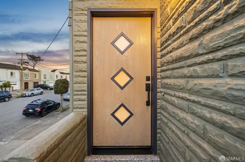 an aerial view of a house with parking space