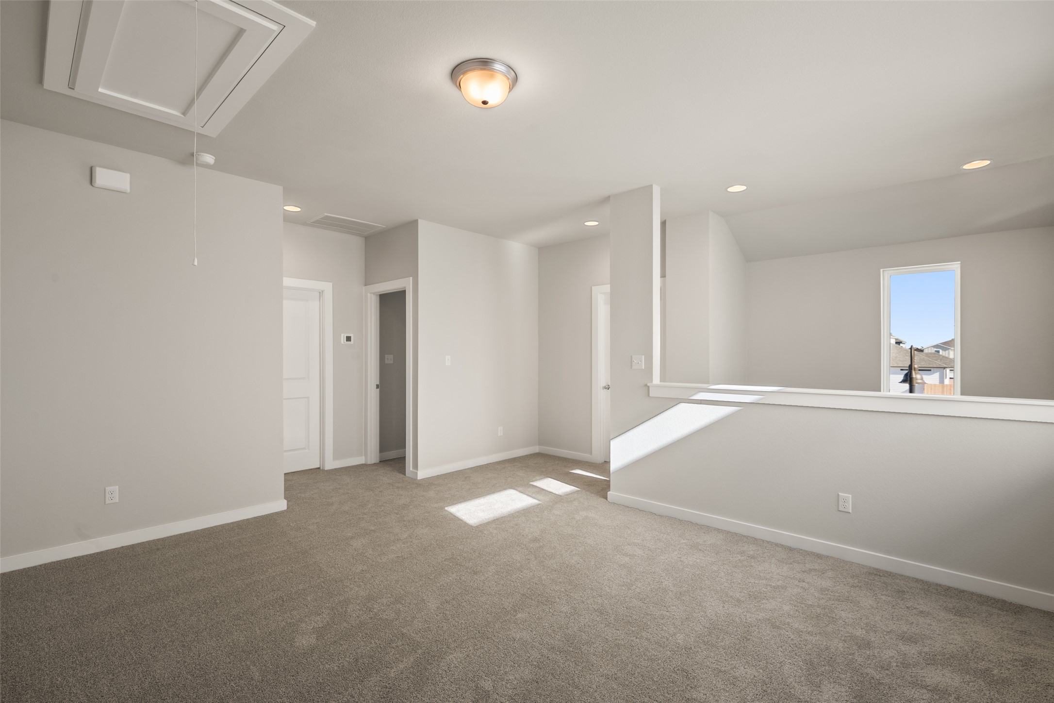17408 Monastrell Lane Pflugerville, TX 78664 - Photo 14 of 31 Carpeted spare room with attic access and recessed lighting