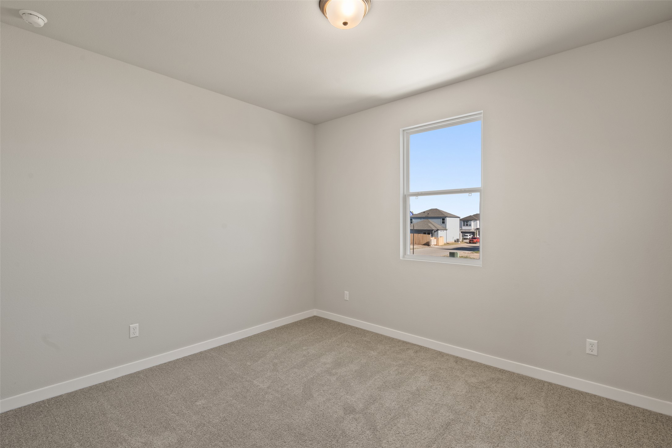 17408 Monastrell Lane Pflugerville, TX 78664 - Photo 16 of 31 Carpeted empty room with baseboards