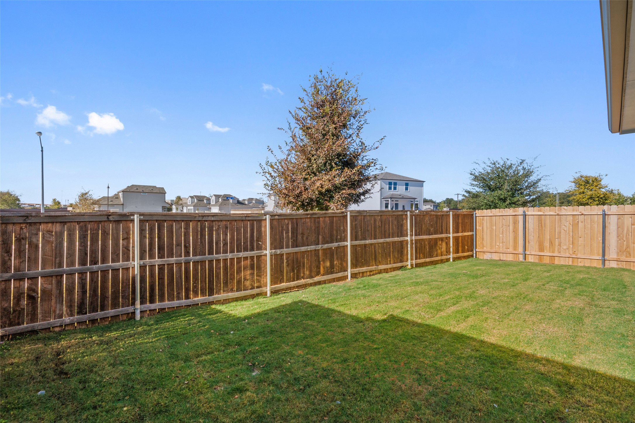 17408 Monastrell Lane Pflugerville, TX 78664 - Photo 24 of 31 Fenced backyard with a residential view