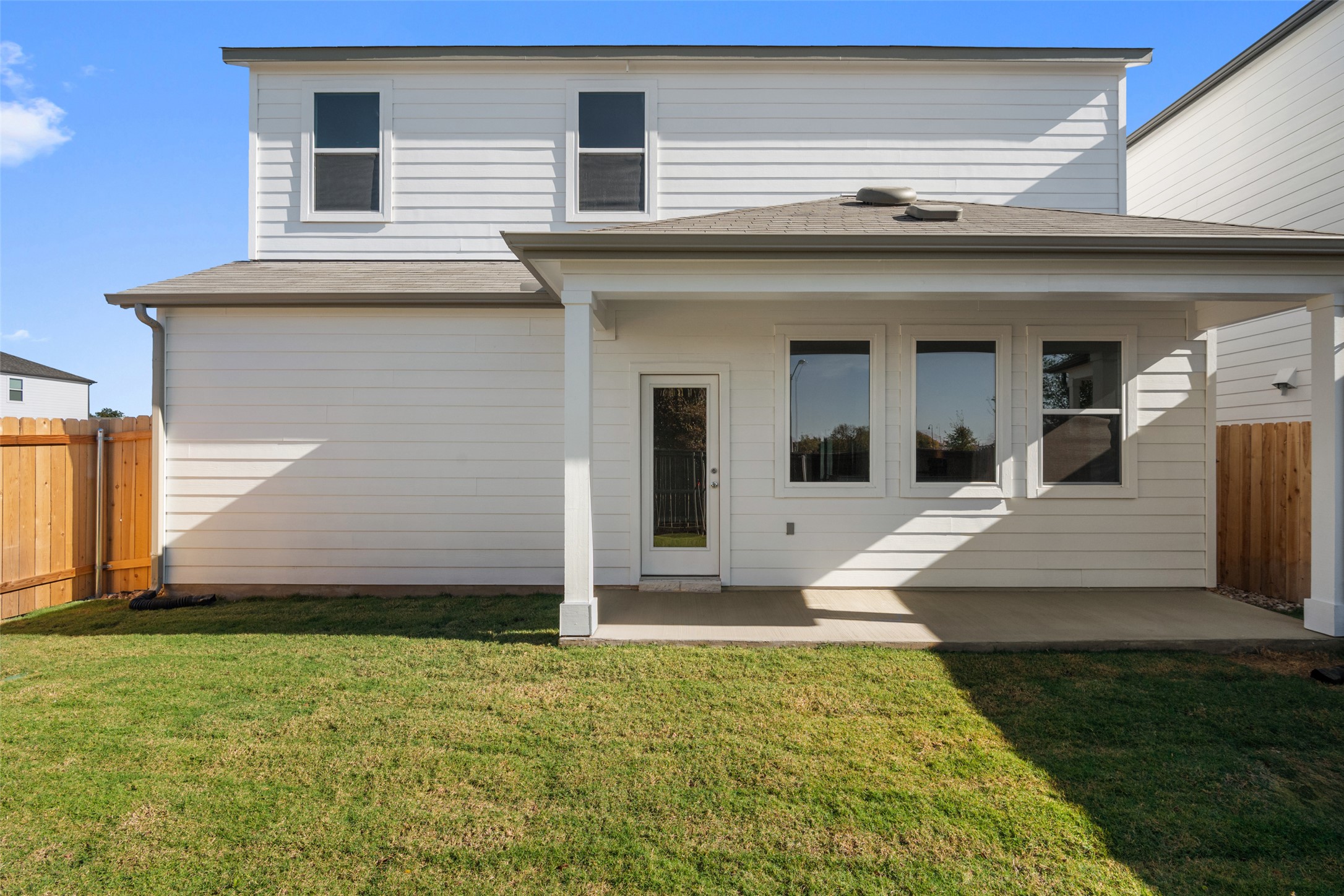 17408 Monastrell Lane Pflugerville, TX 78664 - Photo 25 of 31 Rear view of house featuring a fenced backyard, a patio area, and roof with shingles