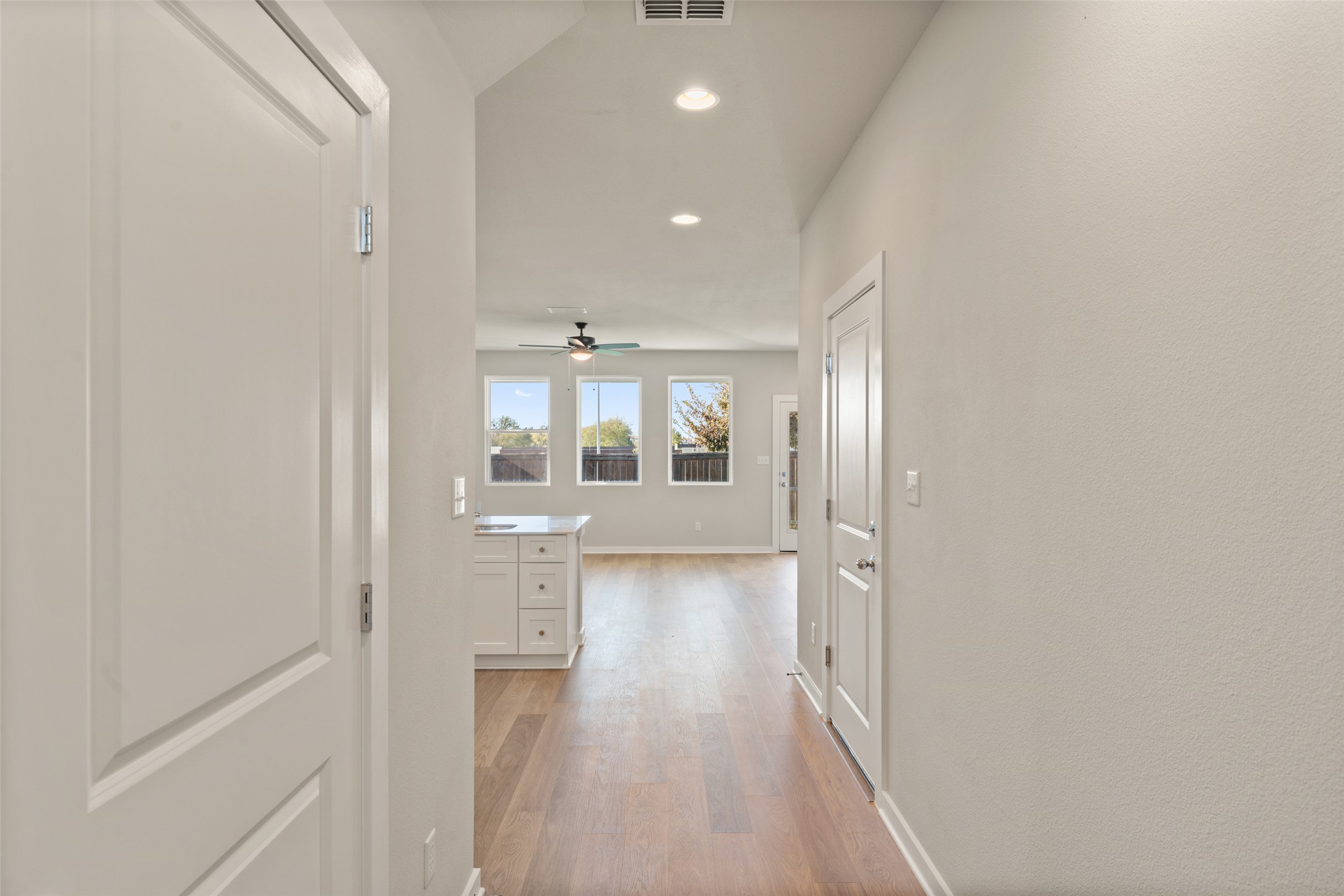 17408 Monastrell Lane Pflugerville, TX 78664 - Photo 3 of 31 Hallway featuring light wood finished floors and recessed lighting