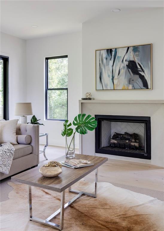551 Sunset Drive Norcross, GA 30071 - Photo 20 of 45 a living room with furniture and a fireplace