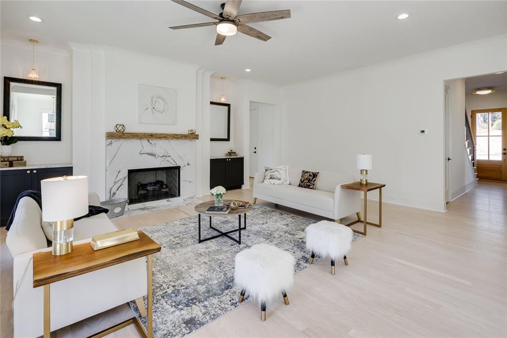 551 Sunset Drive Norcross, GA 30071 - Photo 21 of 45 a living room with furniture and a fireplace