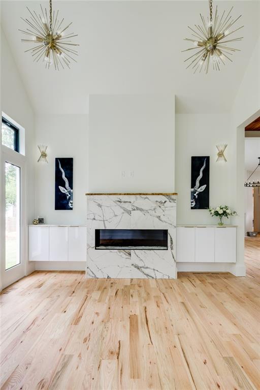 551 Sunset Drive Norcross, GA 30071 - Photo 22 of 45 a living room with a couch a flat screen tv and a fireplace
