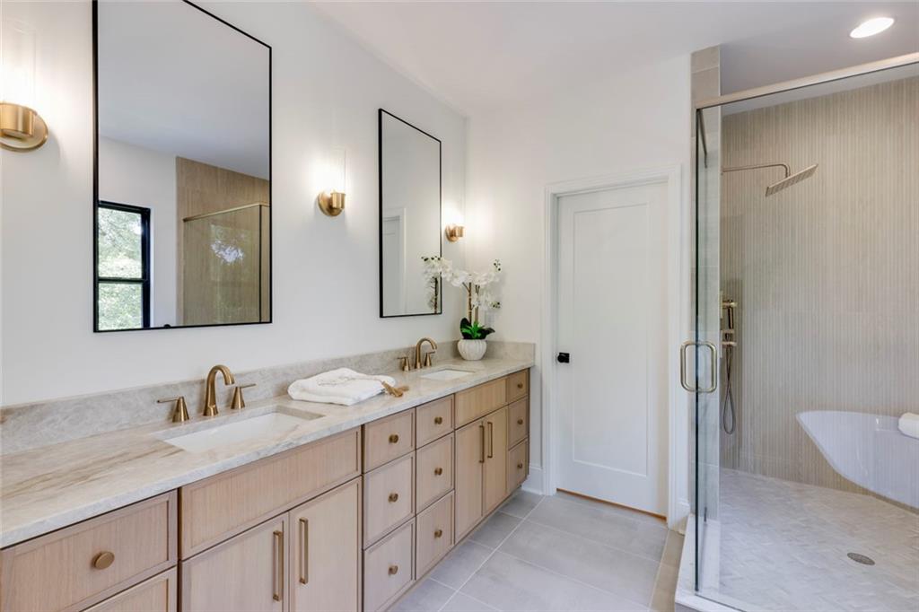 551 Sunset Drive Norcross, GA 30071 - Photo 34 of 45 a spacious bathroom with a granite countertop sink mirror and double