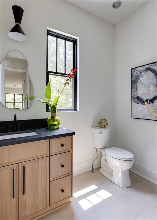 551 Sunset Drive Norcross, GA 30071 - Photo 35 of 45 a bathroom with a toilet sink and mirror