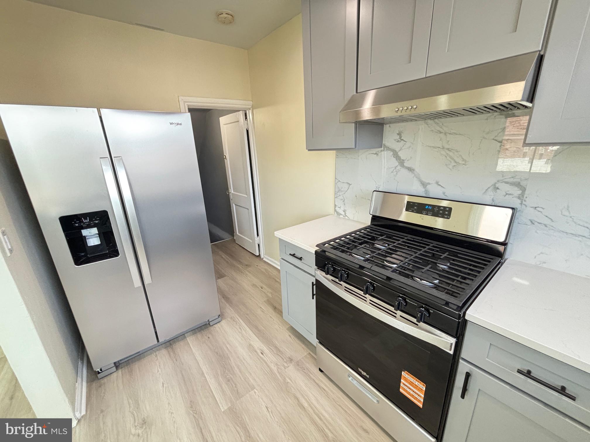 6658 Rutland Street Philadelphia, PA 19149 - Photo 9 of 22 Modern kitchen with sleek appliances.