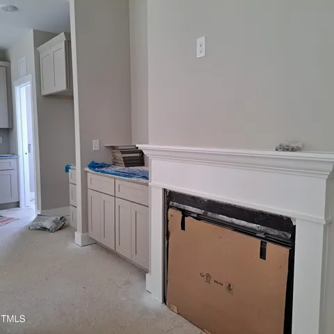 a utility room with cabinets washer and dryer