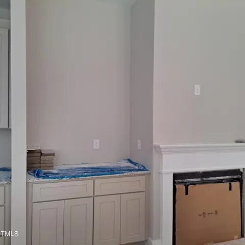 a bathroom with a granite countertop sink and vanity