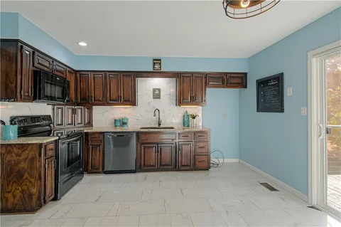 $369,000 | 3828 Northeast Beechwood Drive, Lee's Summit, MO 64064