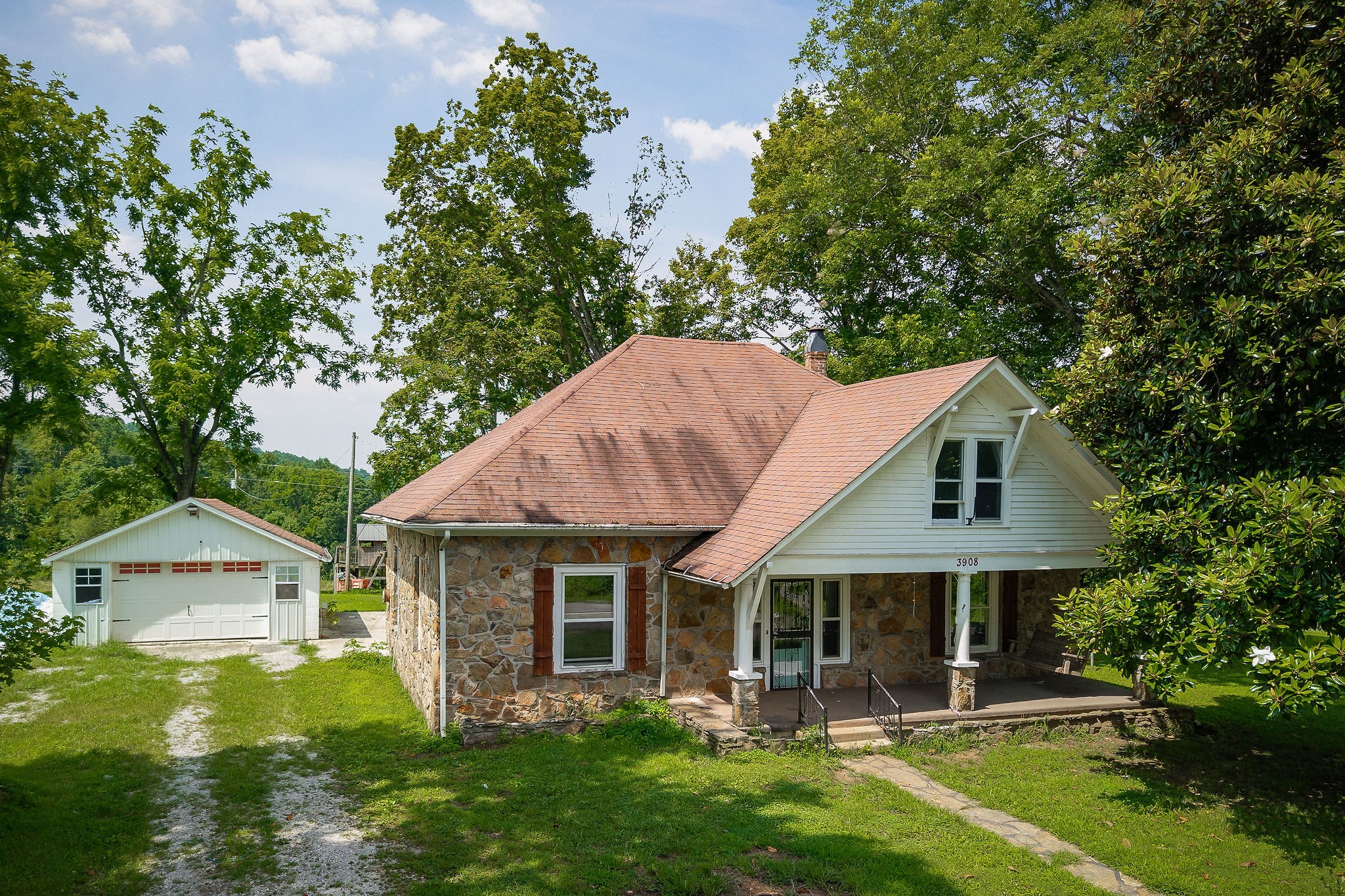 3908 Lost Creek Road Sparta, TN 38583 - Photo 2 of 21 a front view of a house with garden