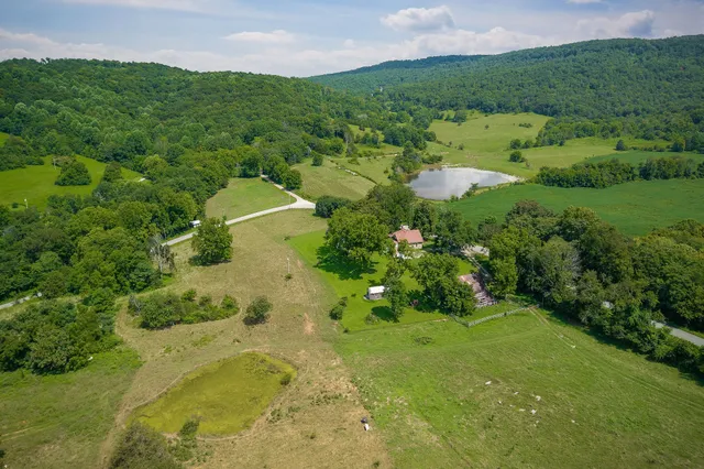 a view of a town with mountains in the background