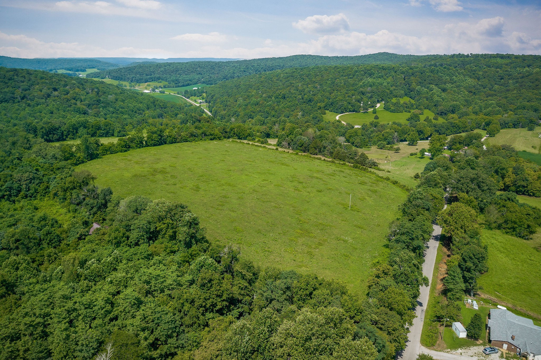3908 Lost Creek Road Sparta, TN 38583 - Photo 10 of 21 a view of a lush green outdoor space with a lake view