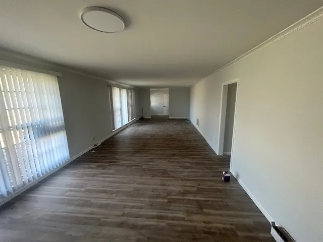 a view of an empty room and window