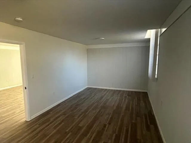 a view of wooden floor in an empty room