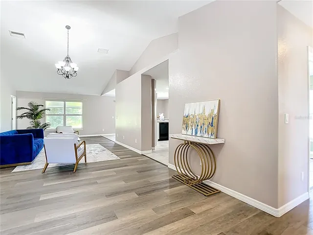a view of a dining room with furniture and window