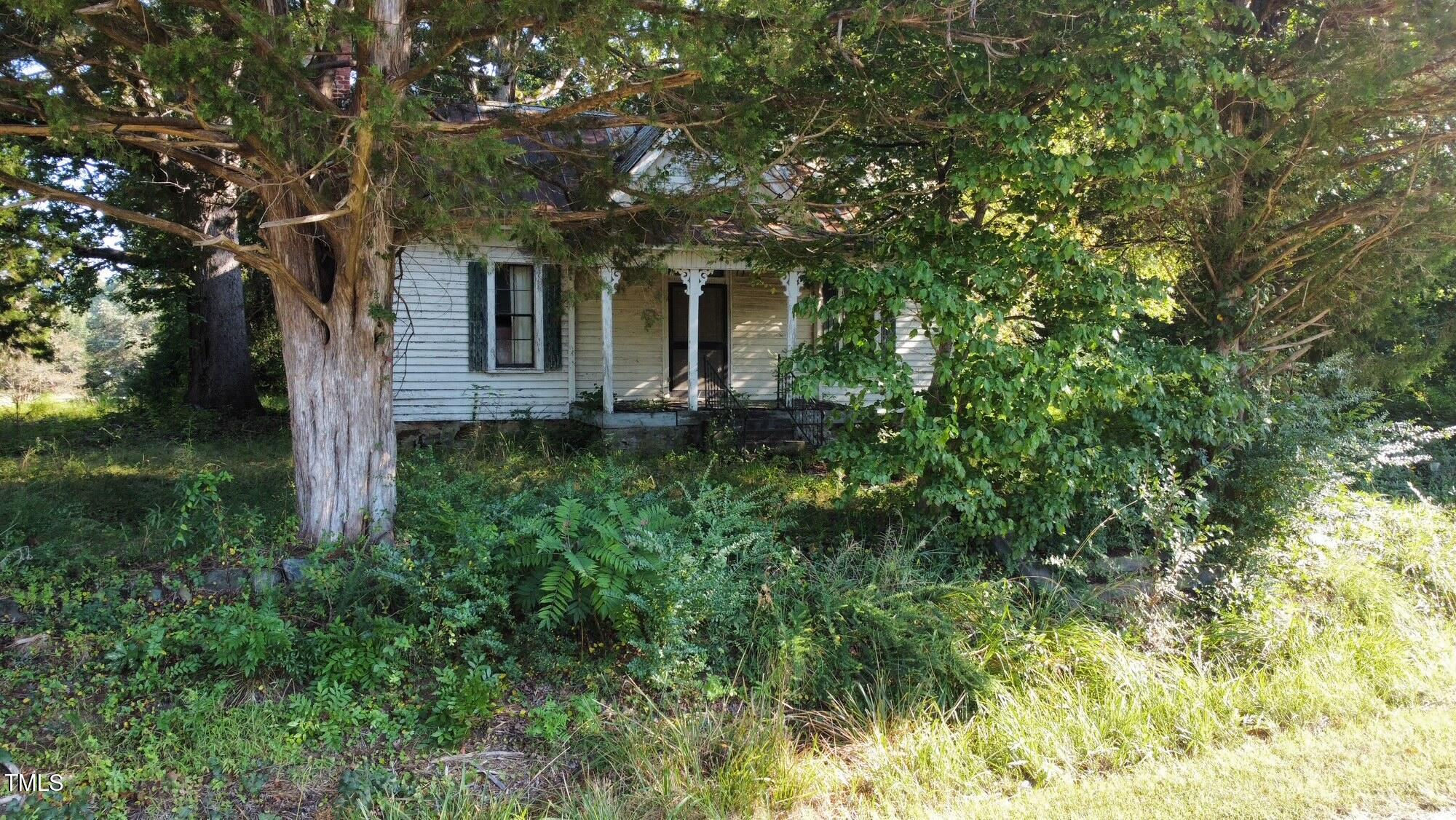 4079 Buckhorn Road Bullock, NC 27507 - Photo 2 of 11 a front view of a house with a yard