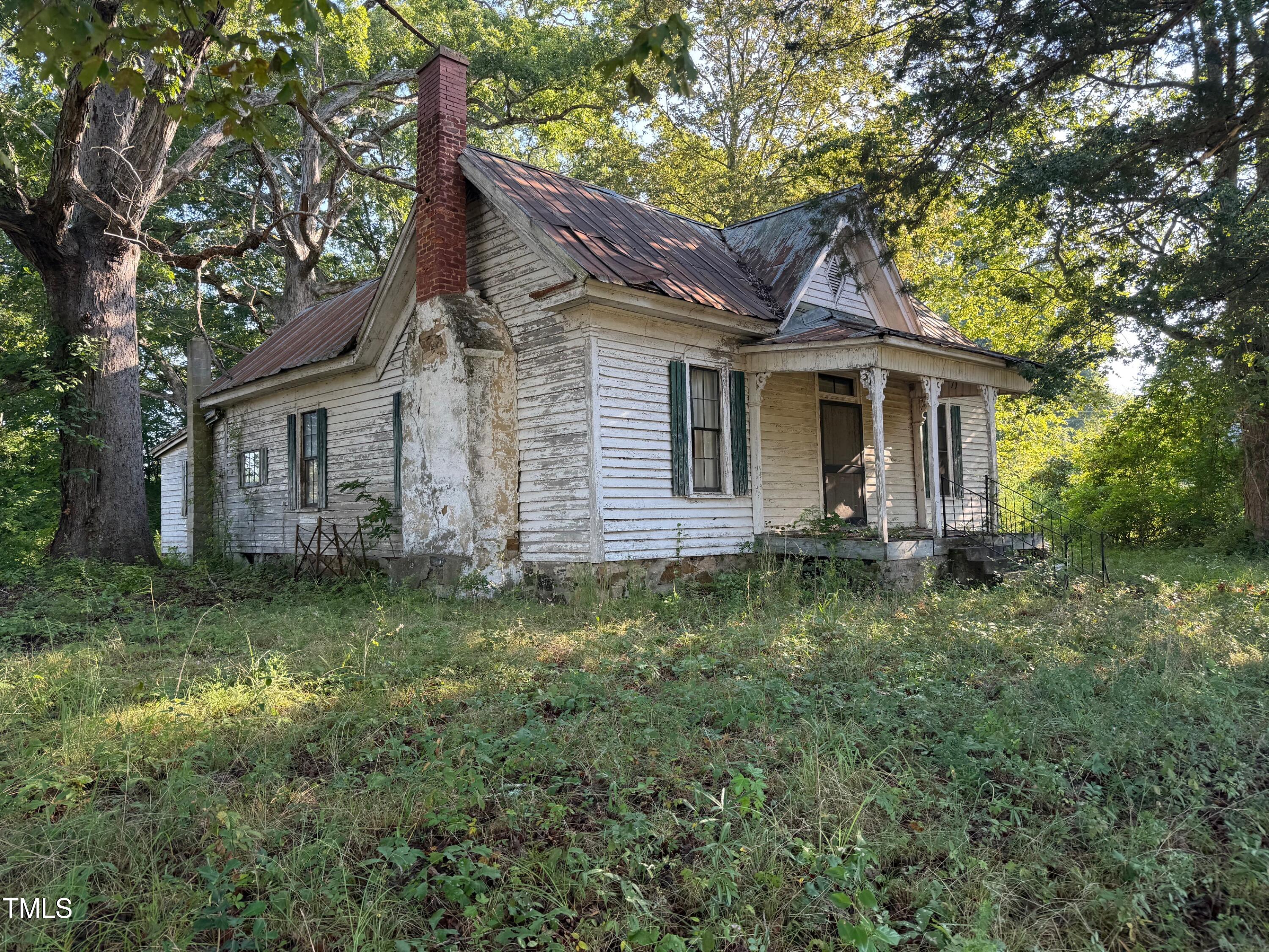 4079 Buckhorn Road Bullock, NC 27507 - Photo 4 of 11 a backyard of a house with seating space