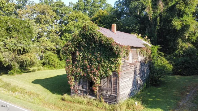 a view of a house with a tree