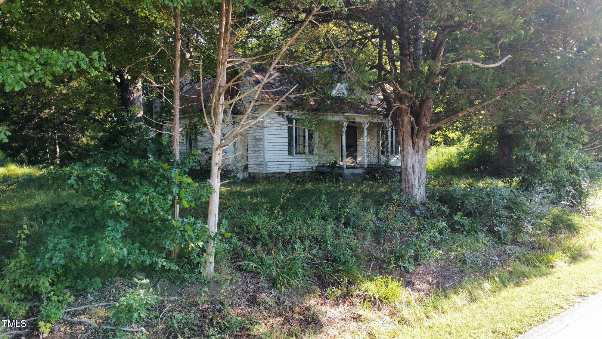 4079 Buckhorn Road Bullock, NC 27507 - Photo 9 of 11 a view of a house with a tree