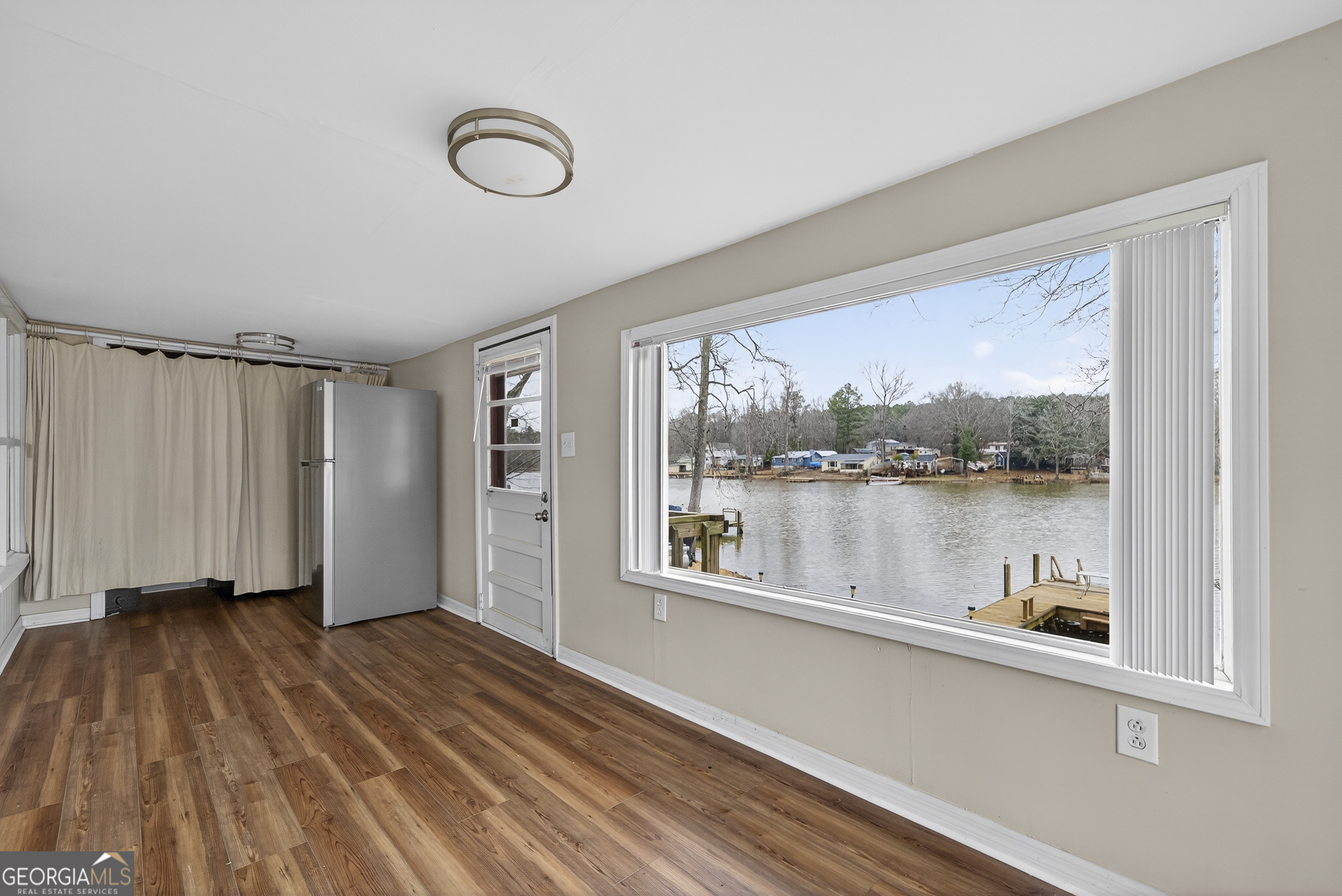 126 Elizabeth Circle Jackson, GA 30233 - Photo 12 of 41 a view of a hardwood floor and a window in a room