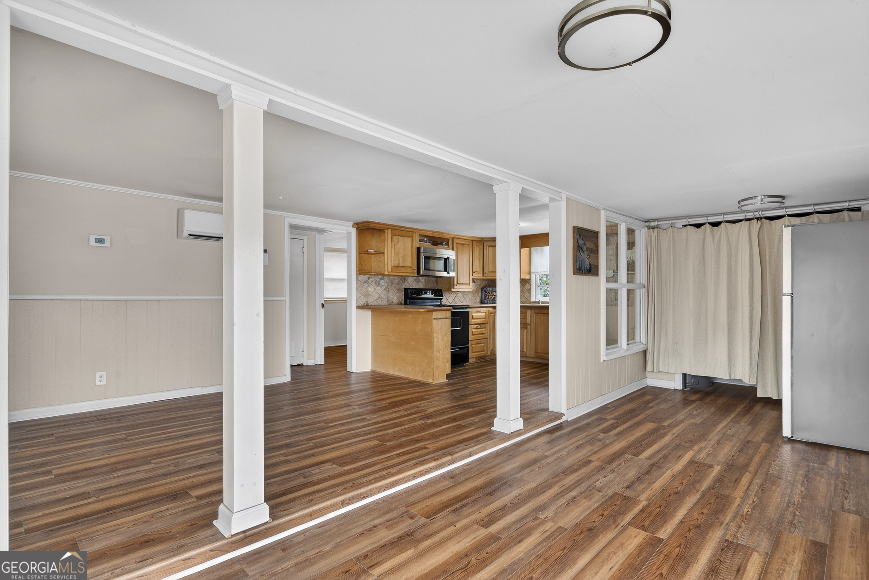 126 Elizabeth Circle Jackson, GA 30233 - Photo 13 of 41 a view of a living room with hardwood floor and a ceiling fan