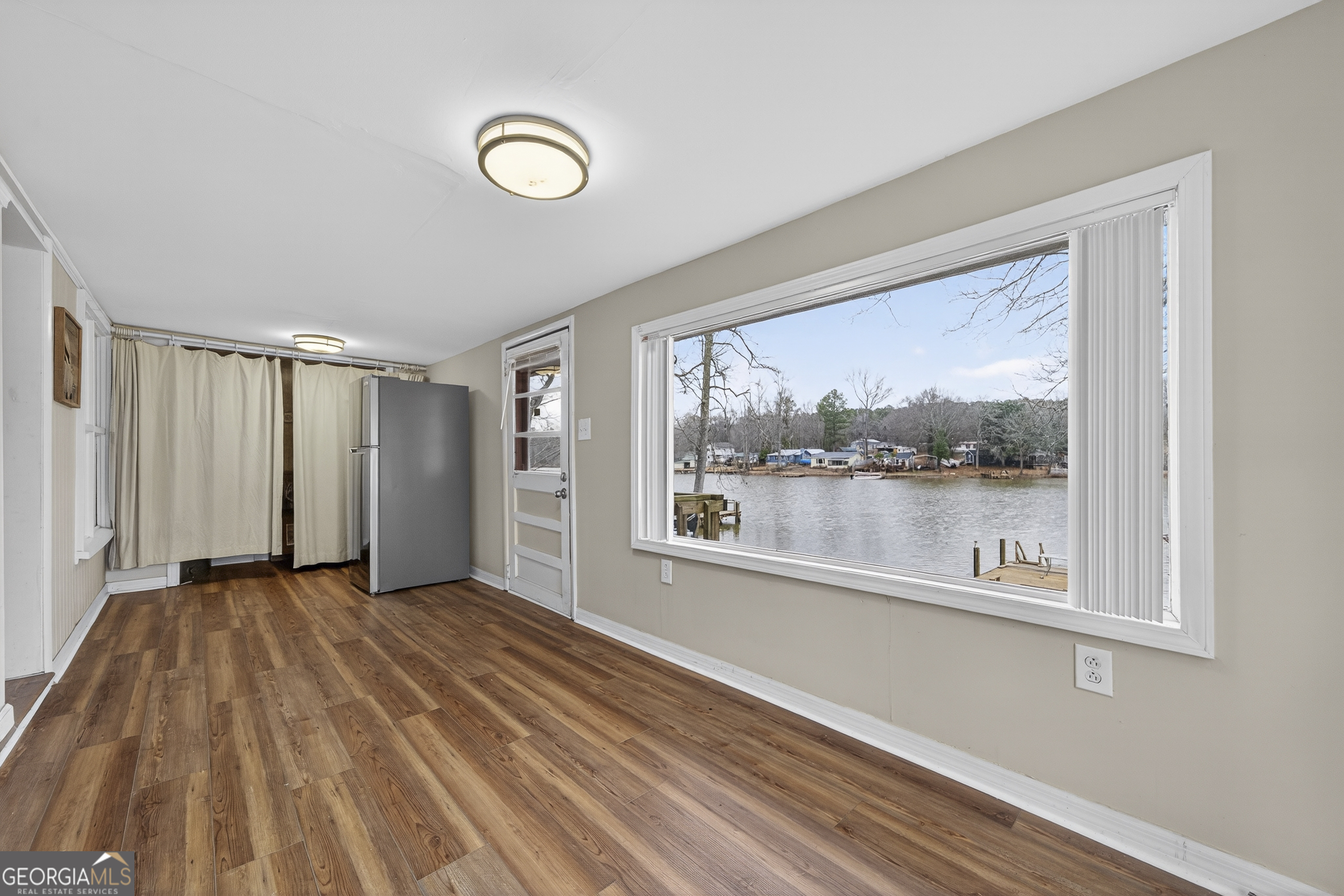 126 Elizabeth Circle Jackson, GA 30233 - Photo 17 of 41 a view of a room with window wooden floor and brick walls