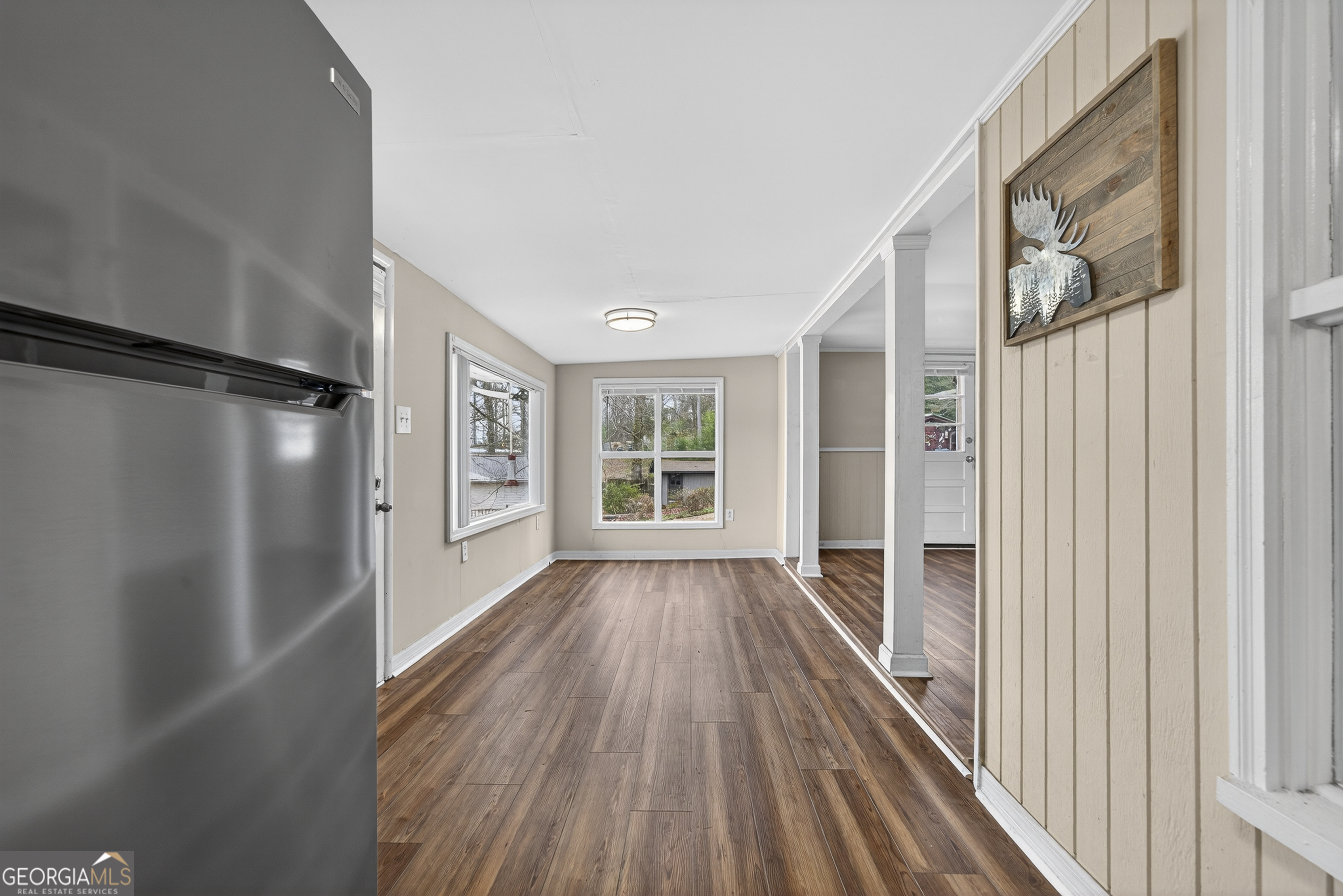 126 Elizabeth Circle Jackson, GA 30233 - Photo 19 of 41 a view of a house with wooden floor a ceiling fan and windows