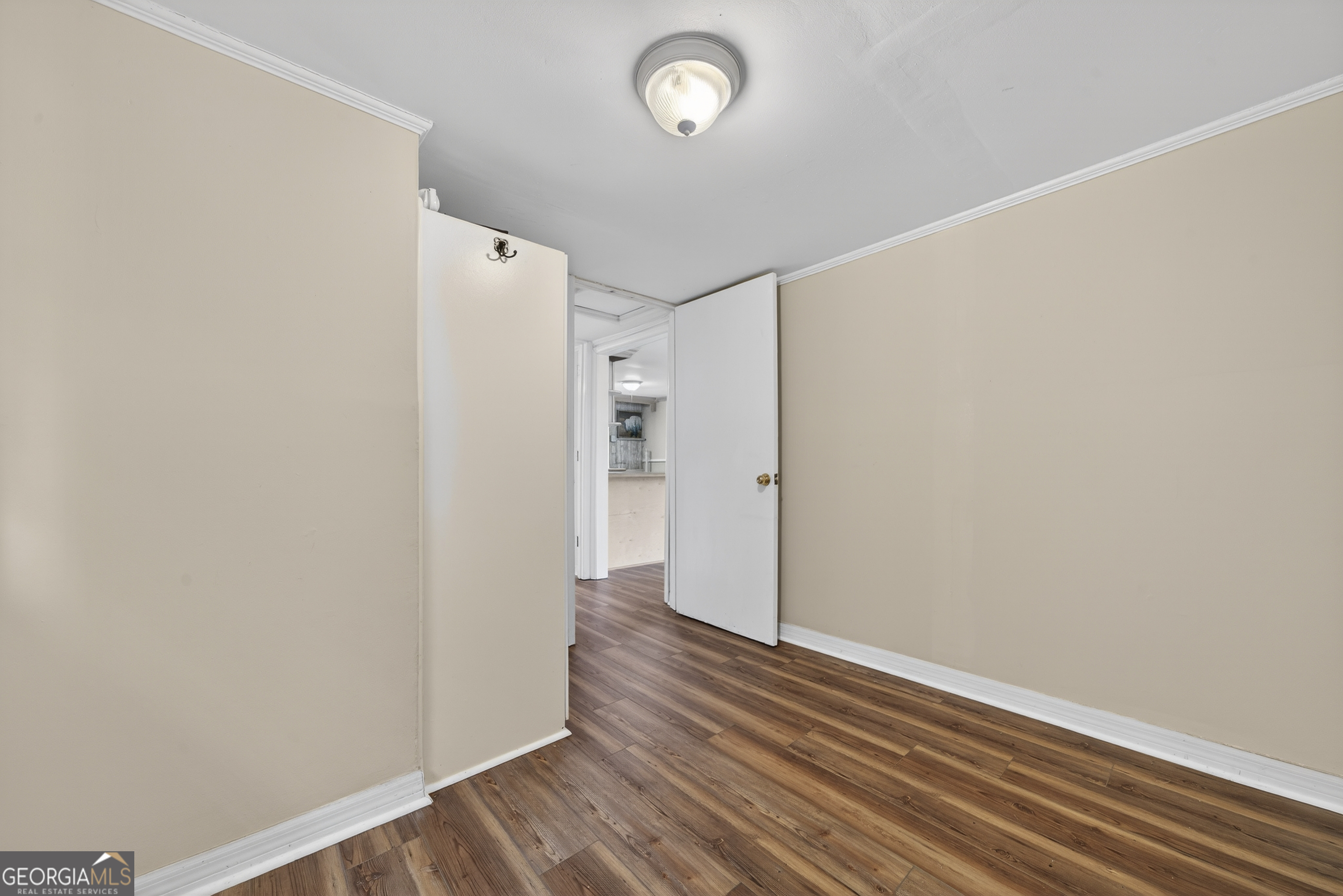126 Elizabeth Circle Jackson, GA 30233 - Photo 21 of 41 a view of an empty room with wooden floor and a window