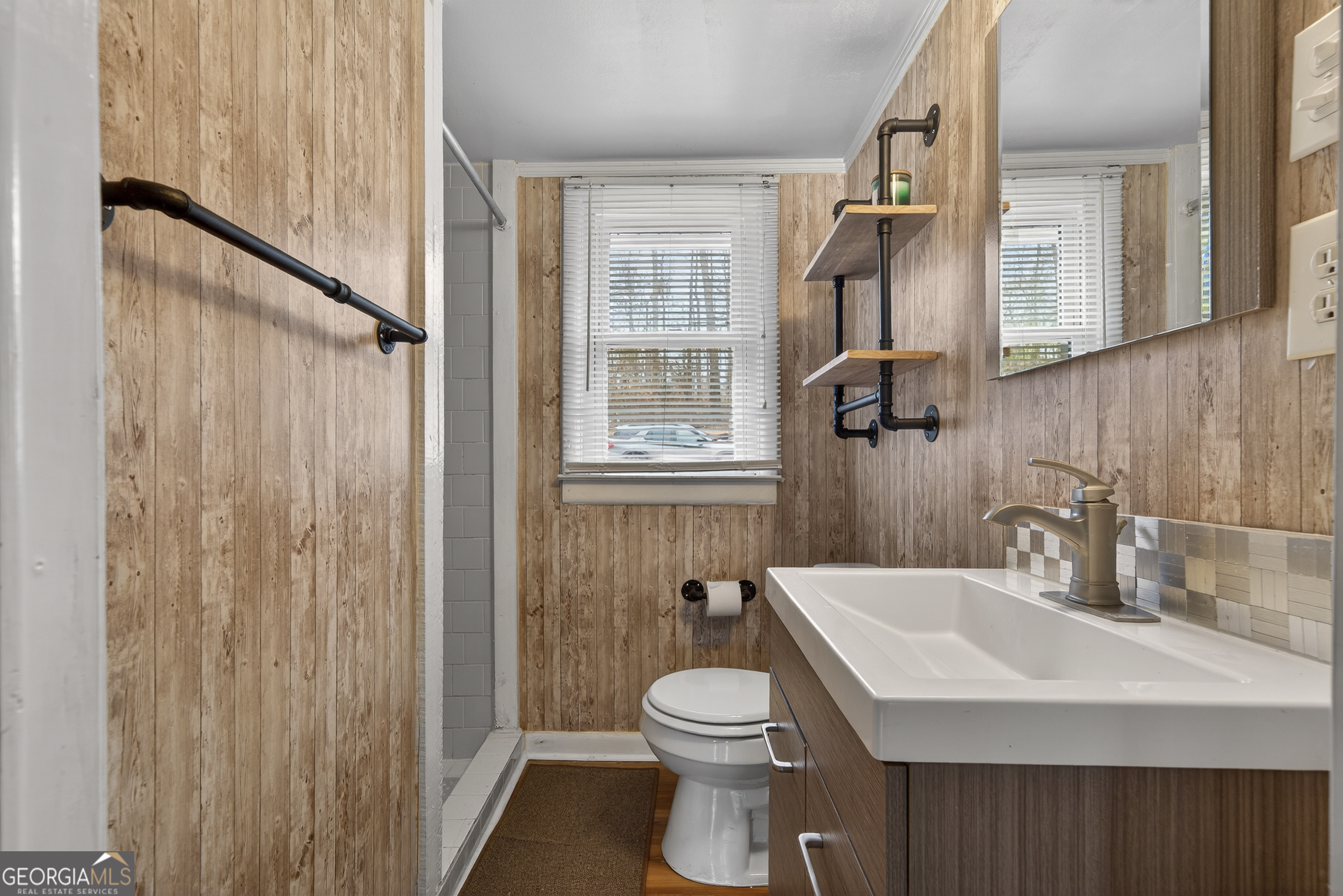 126 Elizabeth Circle Jackson, GA 30233 - Photo 22 of 41 a bathroom with a sink a toilet and shower curtain