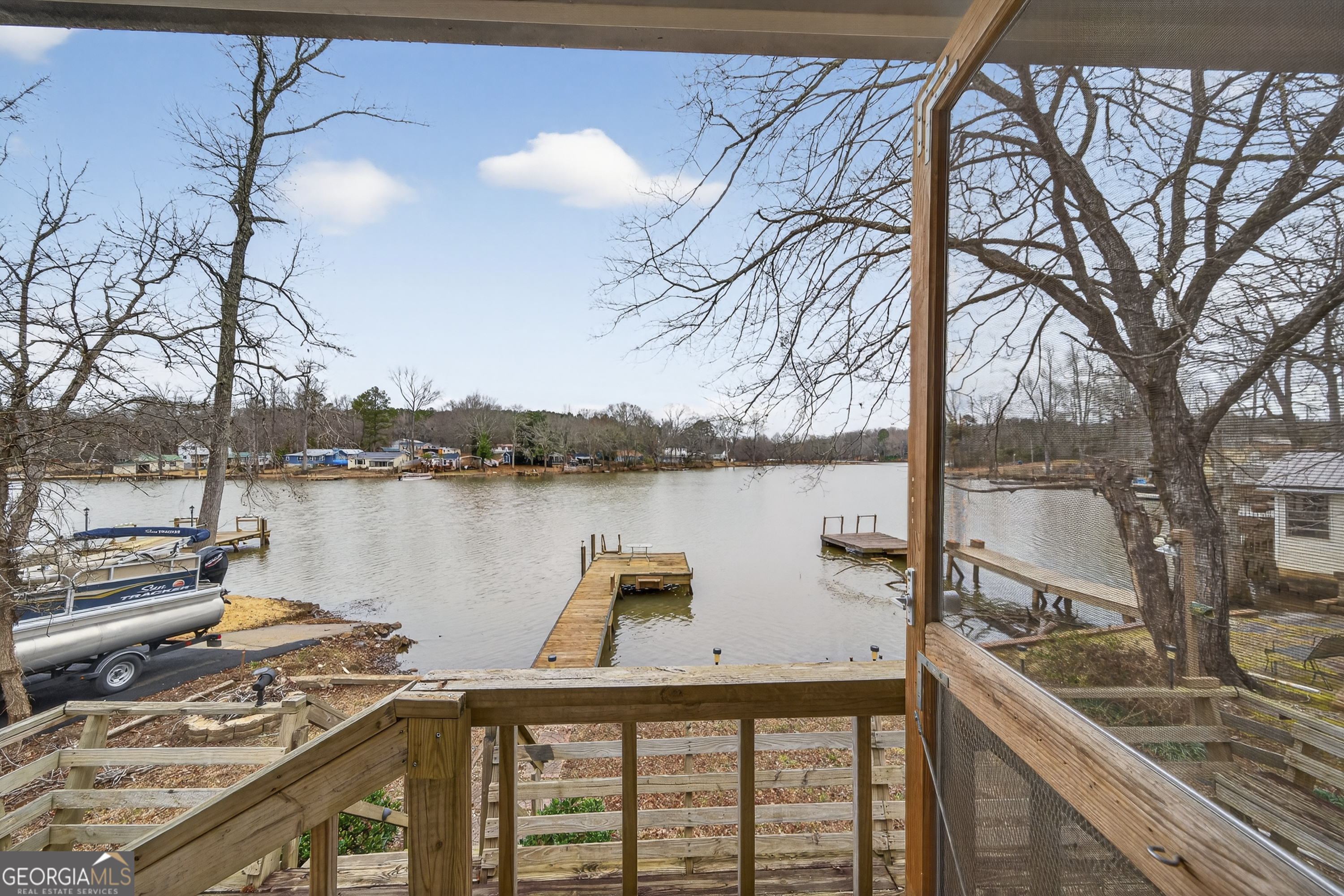 126 Elizabeth Circle Jackson, GA 30233 - Photo 26 of 41 a view of a lake from a balcony