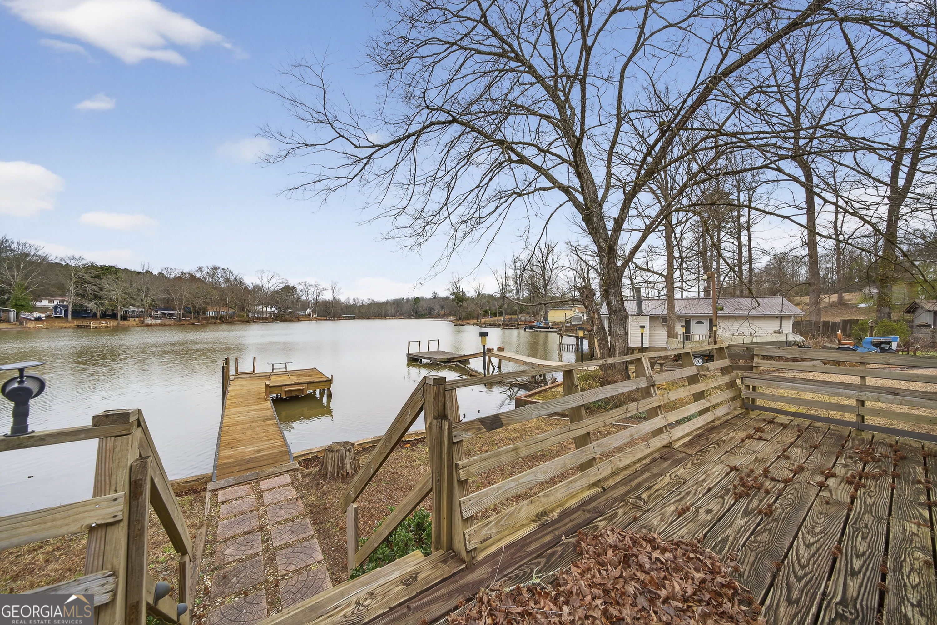 126 Elizabeth Circle Jackson, GA 30233 - Photo 39 of 41 a view of a terrace with chairs and wooden fence