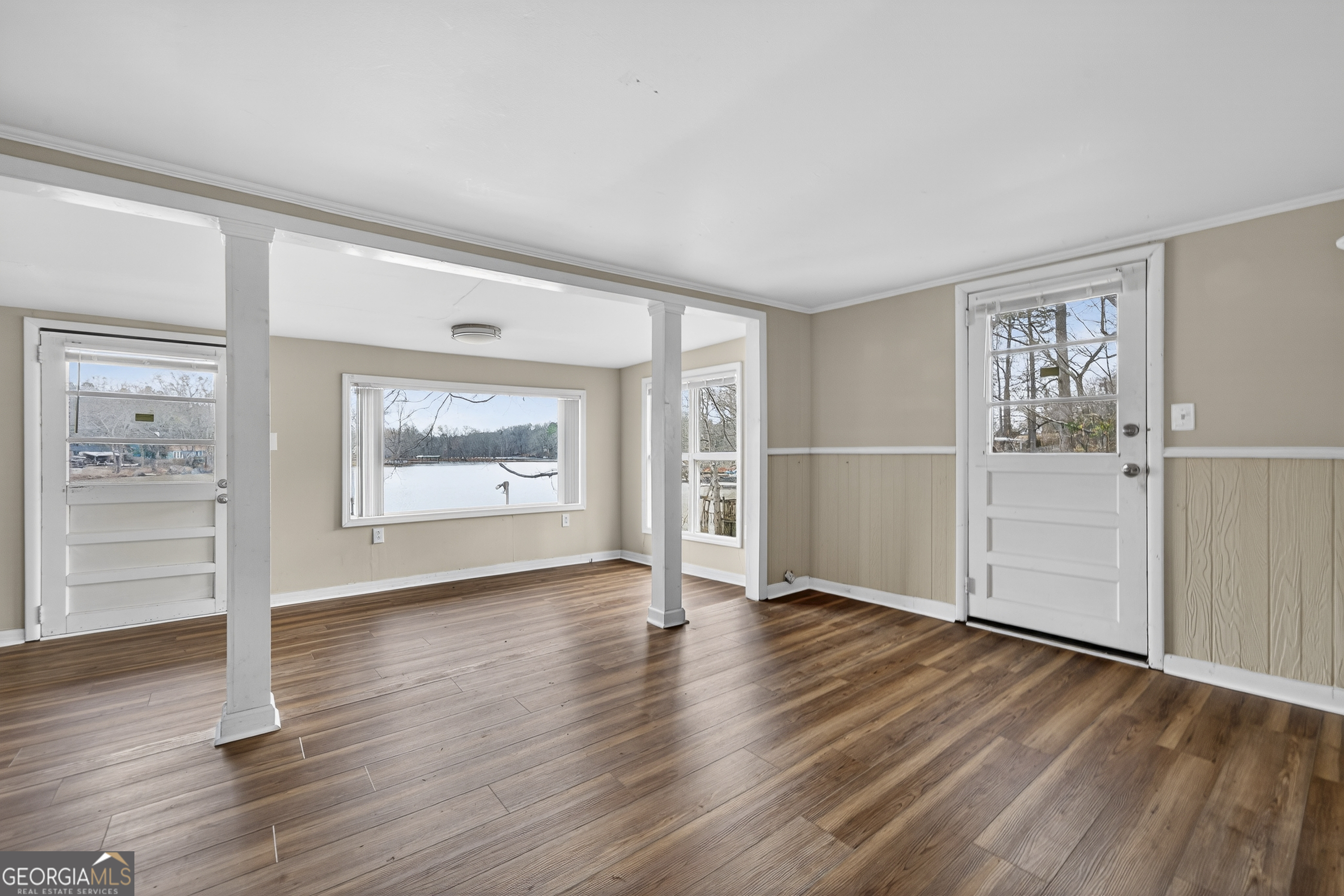 126 Elizabeth Circle Jackson, GA 30233 - Photo 5 of 41 an empty room with wooden floor closet and windows