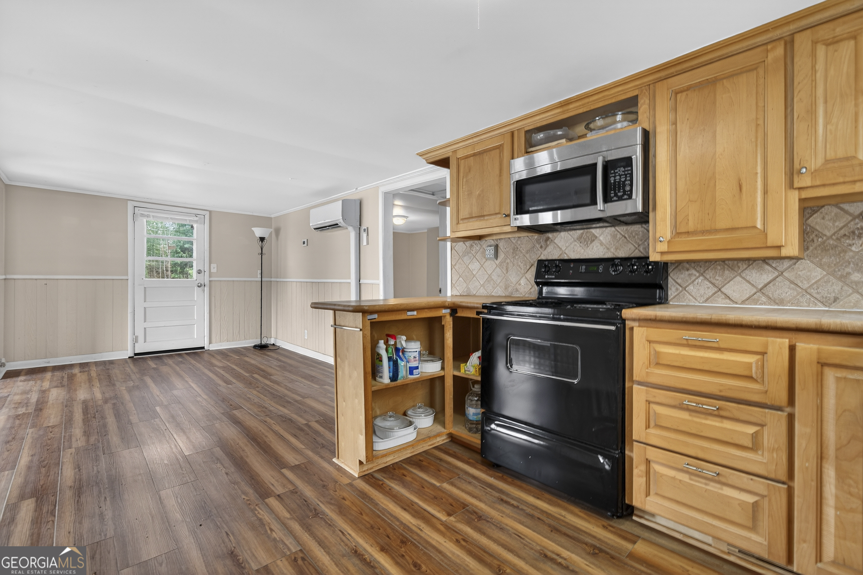 126 Elizabeth Circle Jackson, GA 30233 - Photo 8 of 41 a kitchen with stainless steel appliances a stove and a microwave