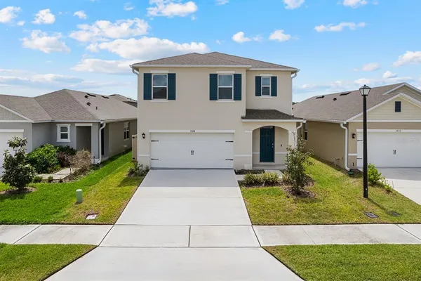 a front view of house with yard