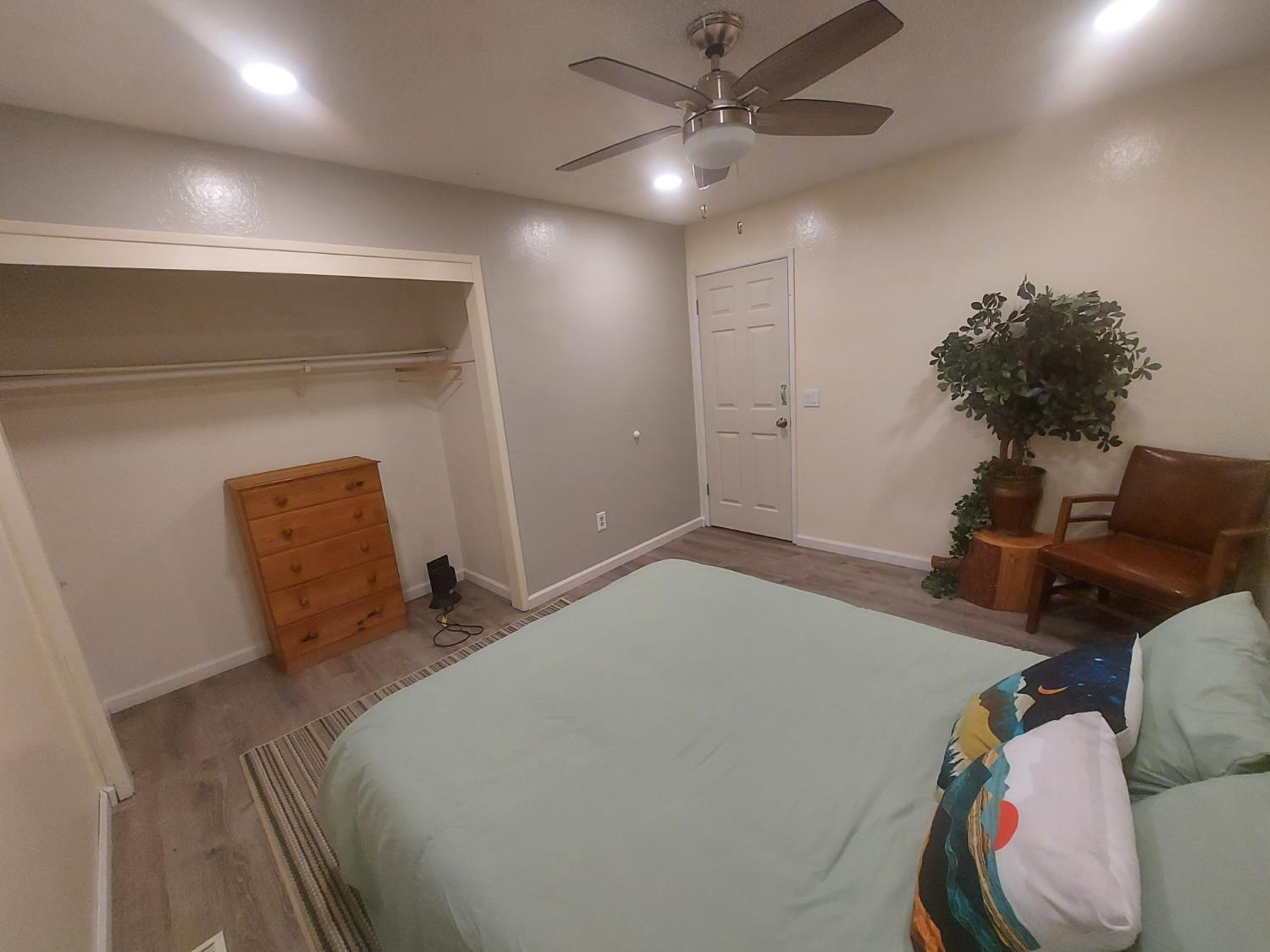 489 Alpine Drive Colfax, CA 95713 - Photo 12 of 46 a bedroom with a bed and a chandelier