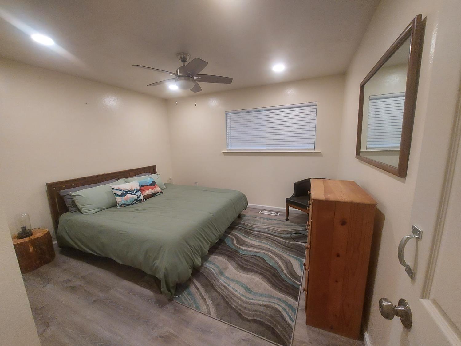 489 Alpine Drive Colfax, CA 95713 - Photo 21 of 46 a bedroom with bed and wooden floor