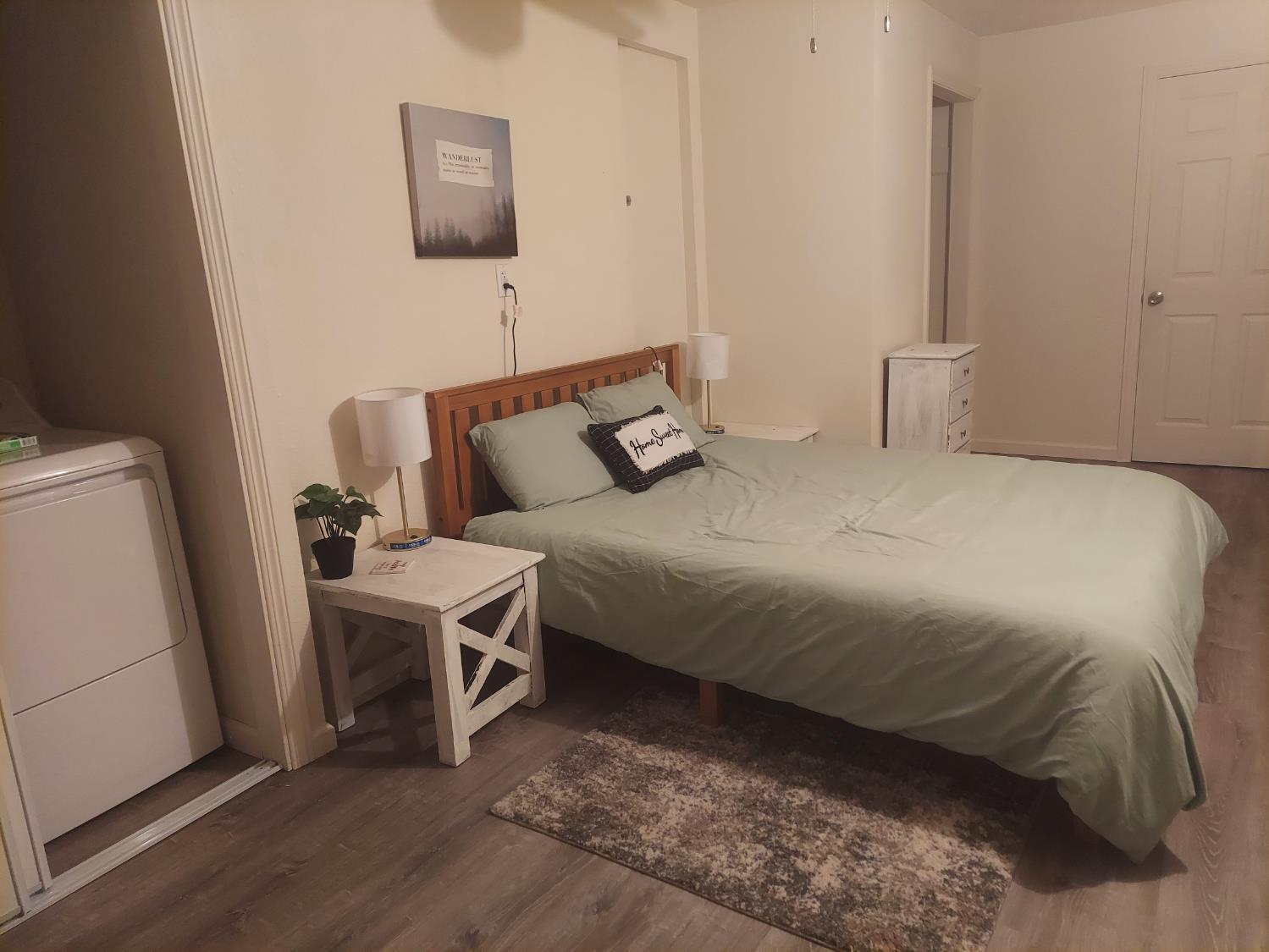 489 Alpine Drive Colfax, CA 95713 - Photo 26 of 46 a bedroom with a bed and a mirror