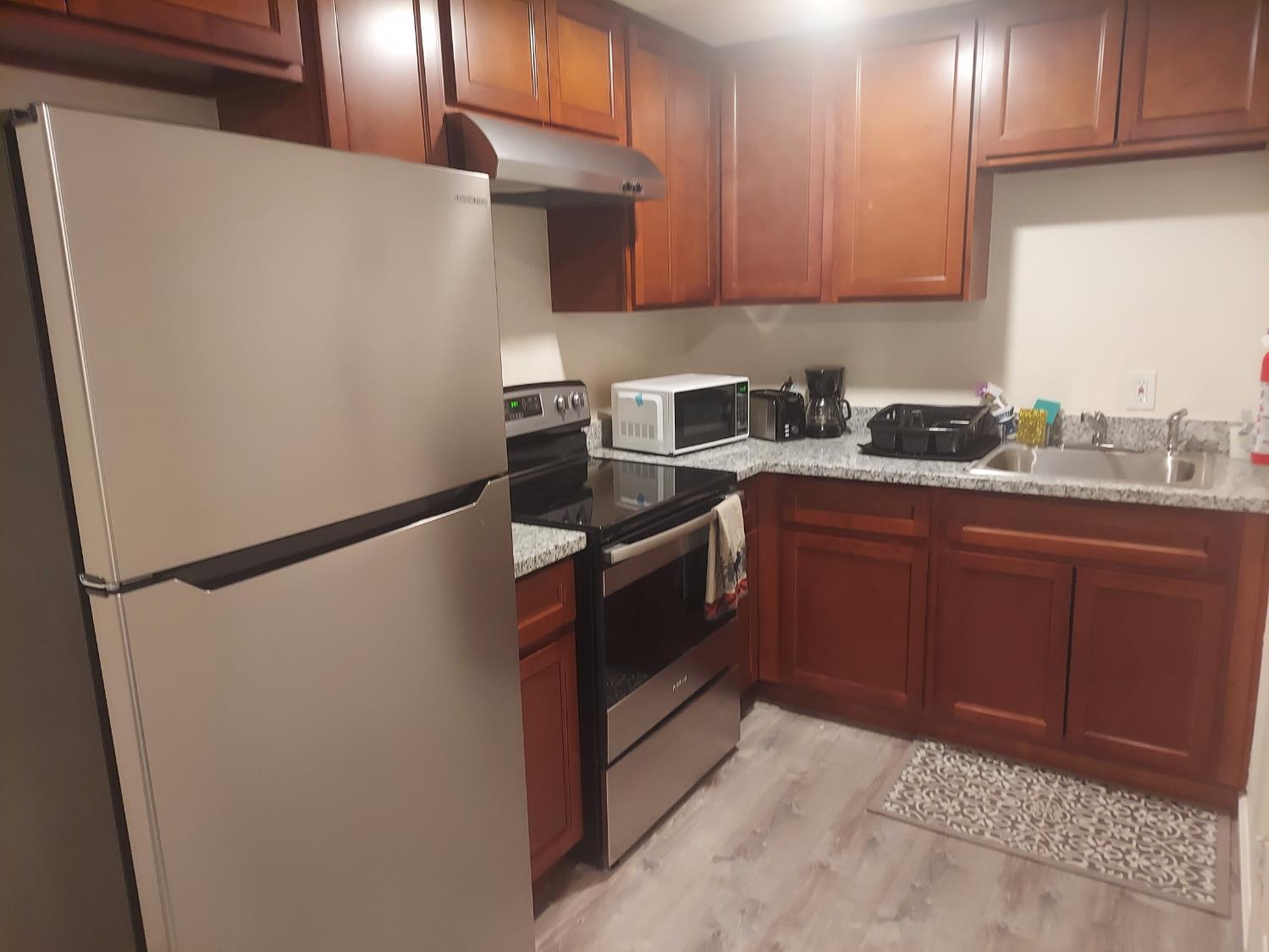 489 Alpine Drive Colfax, CA 95713 - Photo 30 of 46 a kitchen with a refrigerator sink and cabinets