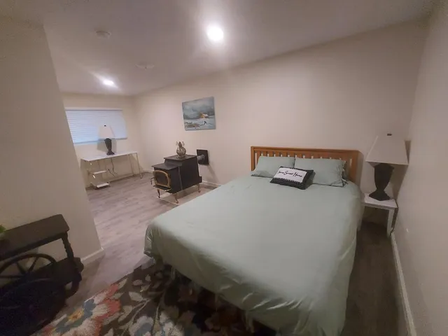 a bedroom with a bed and furniture