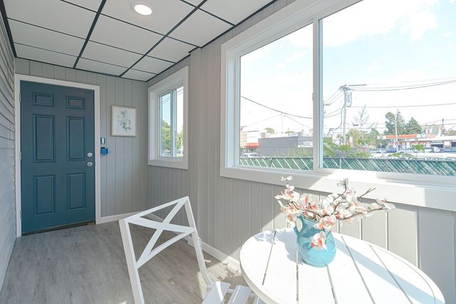 a dining room with furniture and wooden floor