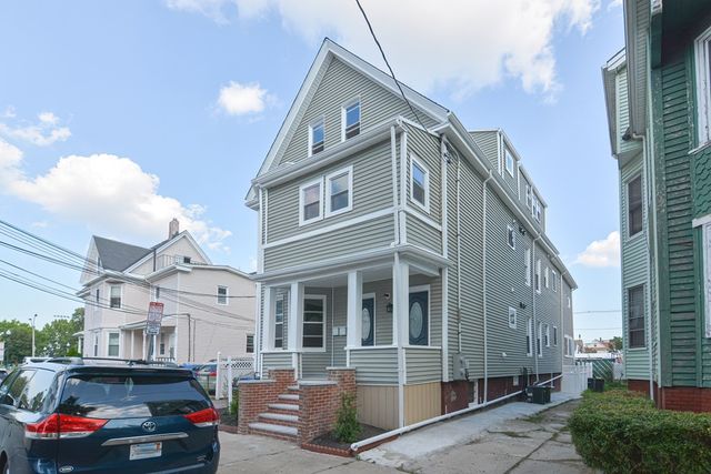 a car parked in front of a building